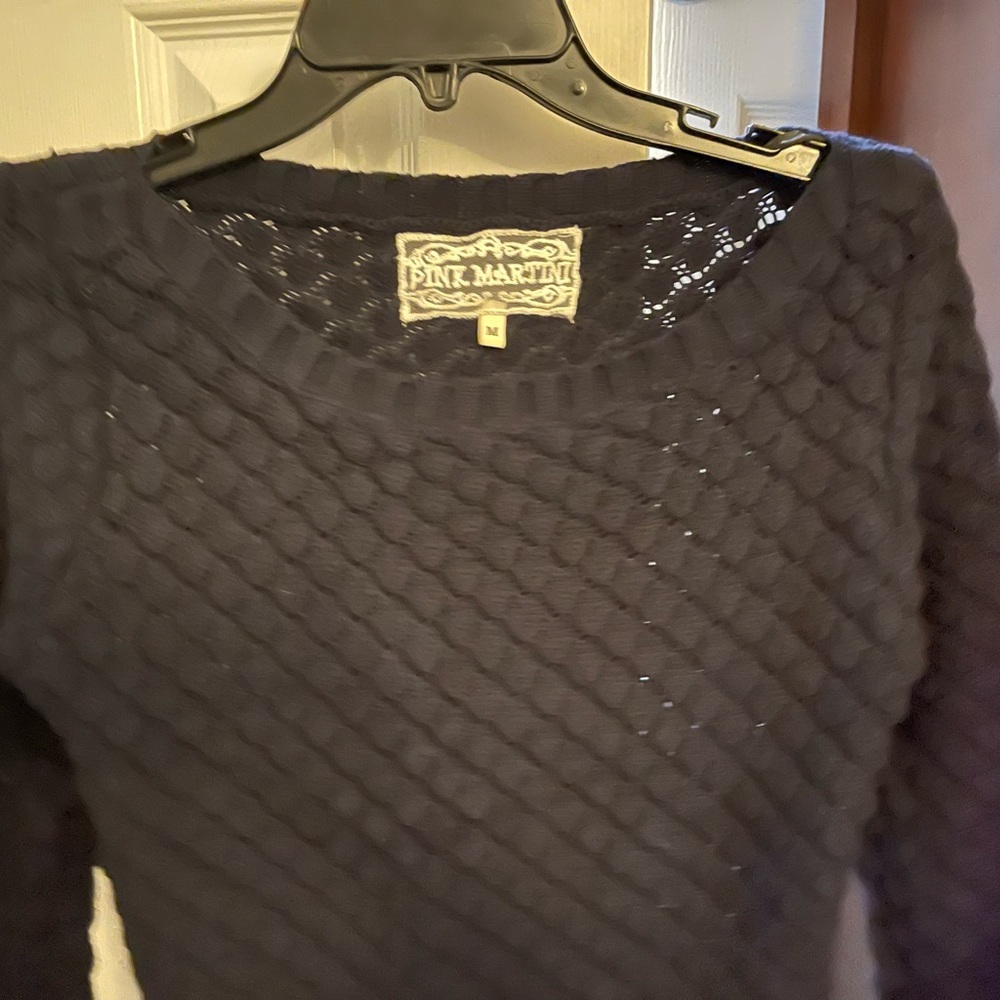 Anthropologie’s pink martini navy sweater